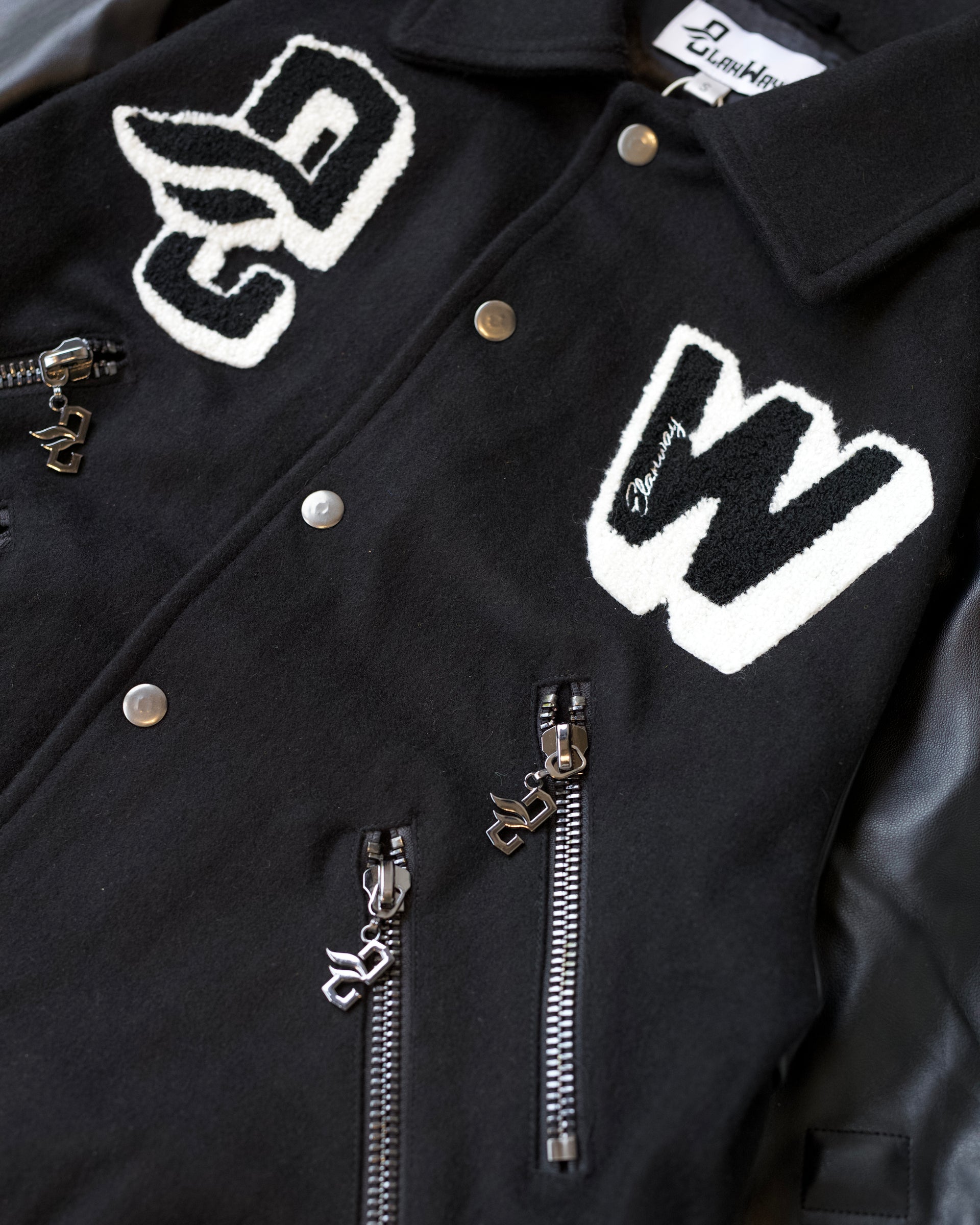 ElanWay Embossed Varsity Jacket In Black - Cropped Length